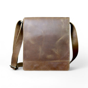 Man wearing a brown leather messenger bag crossbody style