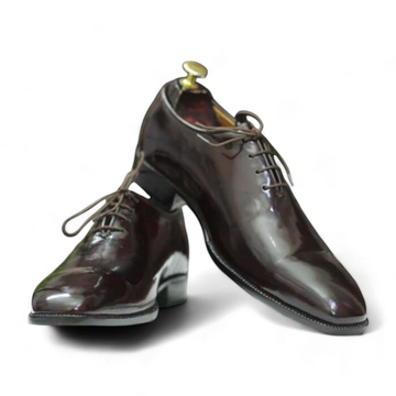 Men's brown patent leather single monk shoes with a sleek design, featuring a glossy leather upper, single buckle strap, and a durable leather sole, ideal for formal occasions