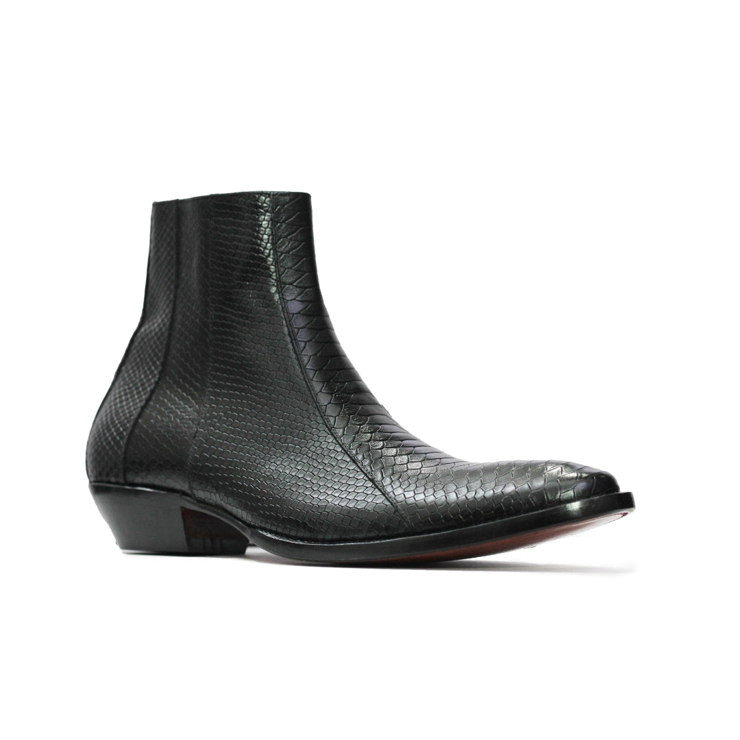 Black lizard skin ankle boot on a white background