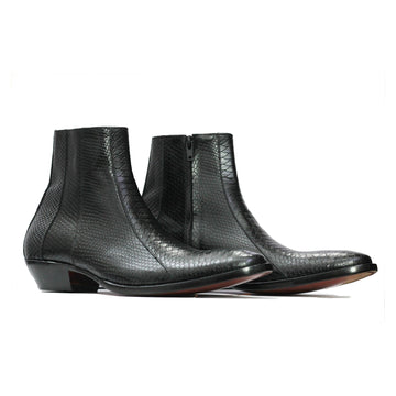 Pair of black textured ankle boots on a white background