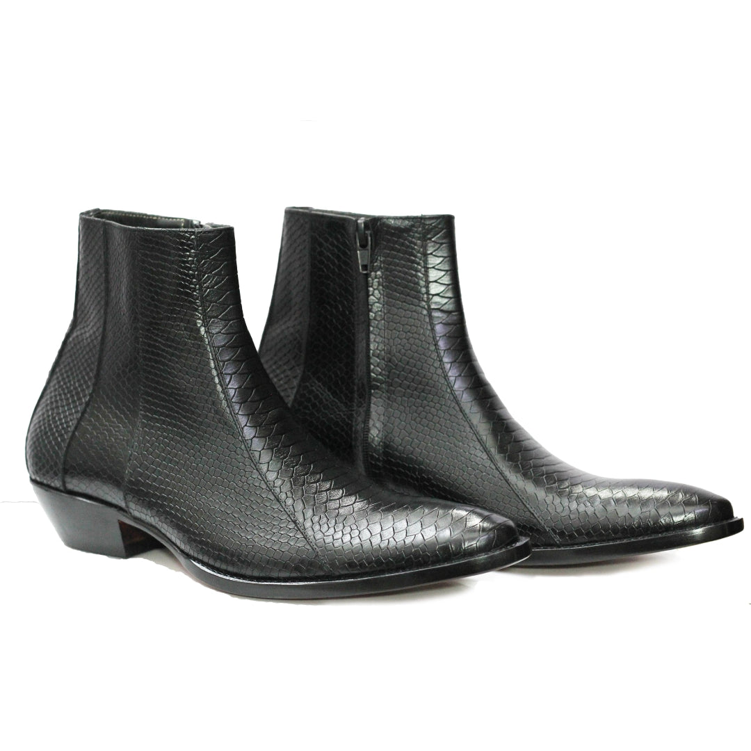 Pair of black textured ankle boots on a white background 