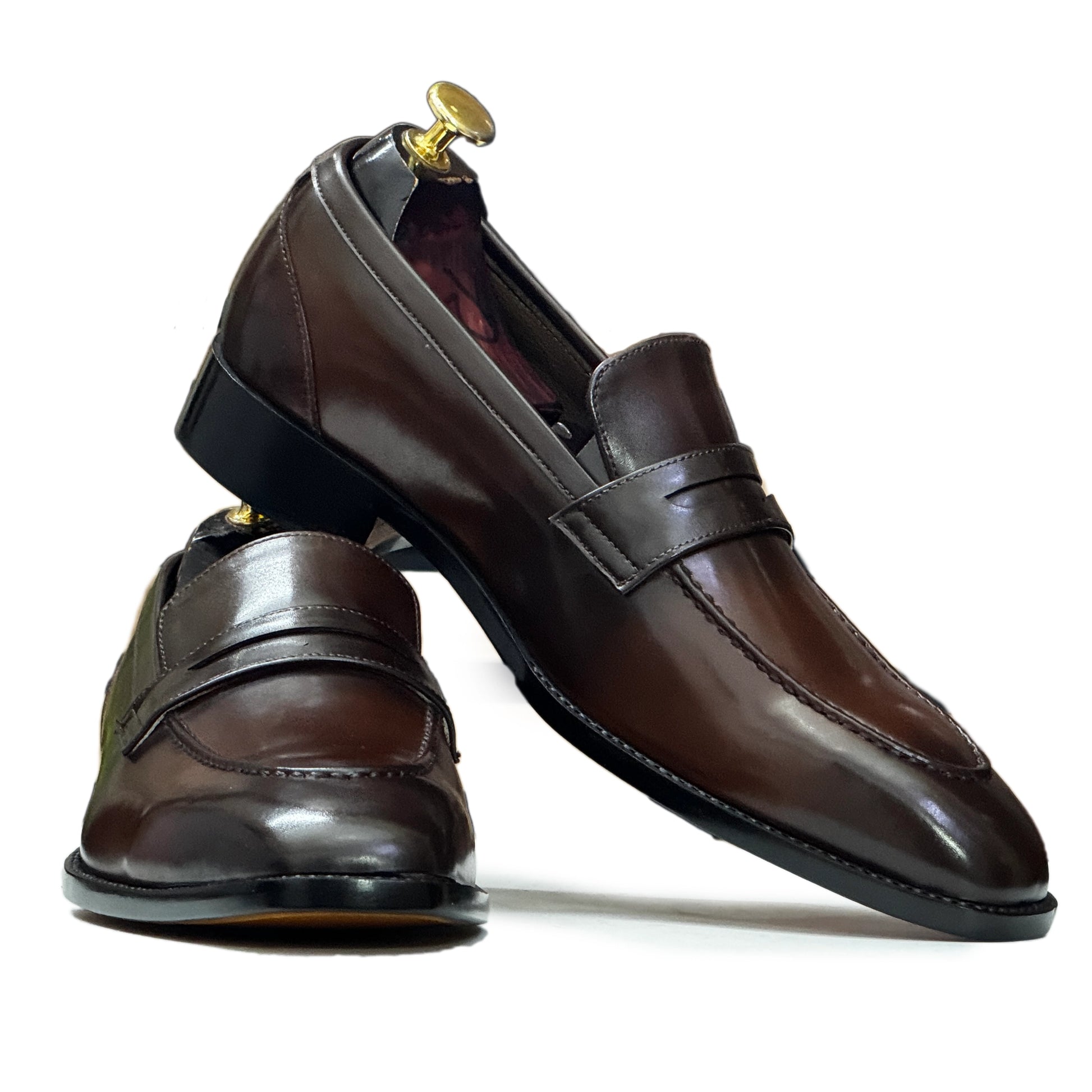 Close-Up of Leather – Close-up of premium brown leather used in Handmade Men’s Slip-On Loafers, highlighting fine stitching and polished finish.


