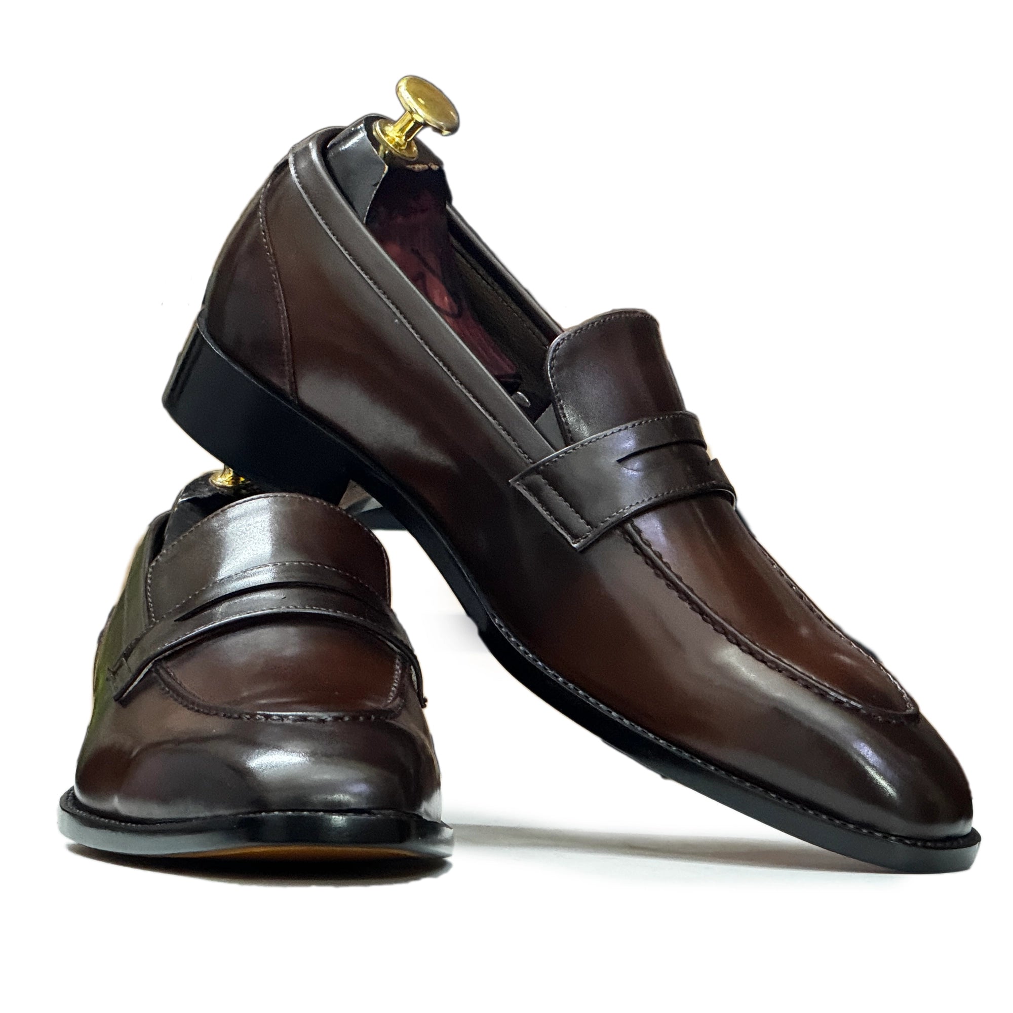 Close-Up of Leather – Close-up of premium brown leather used in Handmade Men’s Slip-On Loafers, highlighting fine stitching and polished finish.

