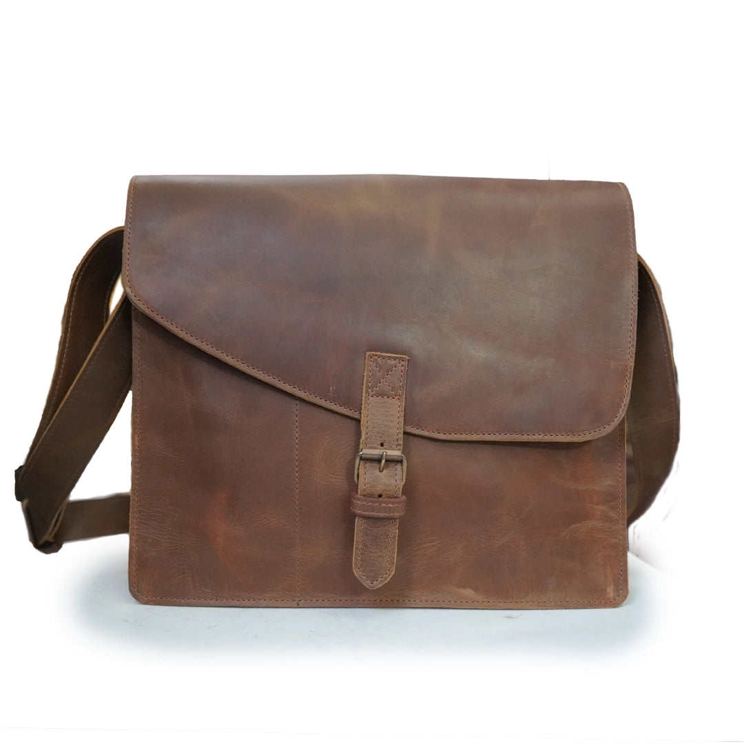 Brown leather satchel bag on a white background