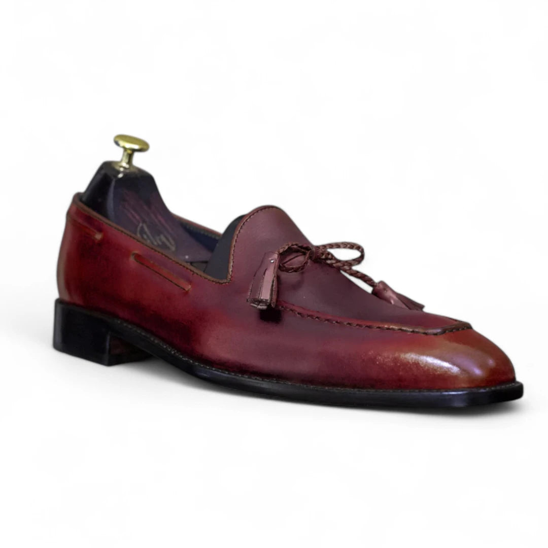 Brown leather loafer shoe on a white background