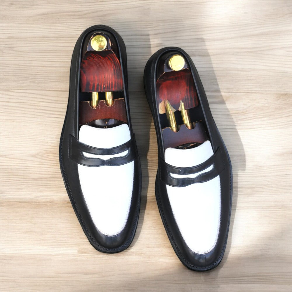 Black and white leather penny loafers on white background from Posh Footwears