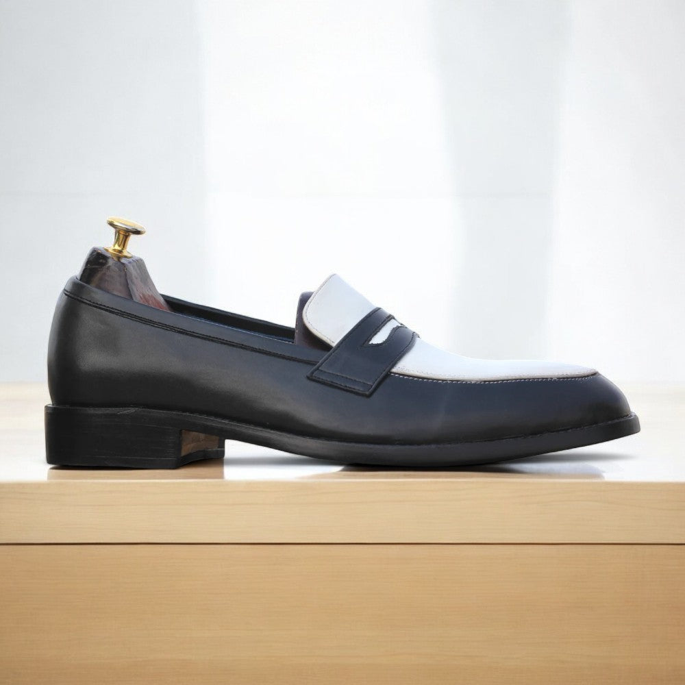 Black and white leather penny loafers on white background from Posh Footwears
