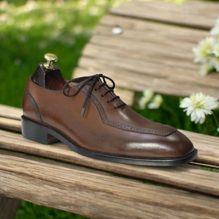 Men's lace-up oxford brown leather dress shoes on a white background
