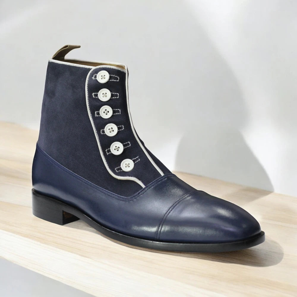 Navy Handmade Leather Button Boots displayed on a wooden surface, highlighting their elegant design and quality craftsmanship.