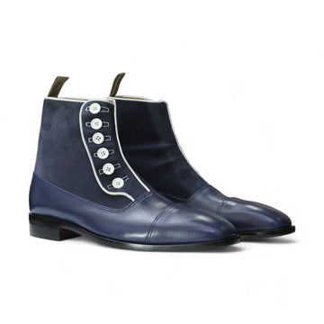 Navy Handmade Leather Button Boots displayed on a wooden surface, highlighting their elegant design and quality craftsmanship.