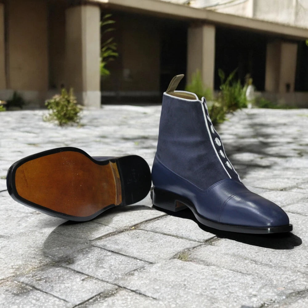 Navy Handmade Leather Button Boots displayed on a wooden surface, highlighting their elegant design and quality craftsmanship.