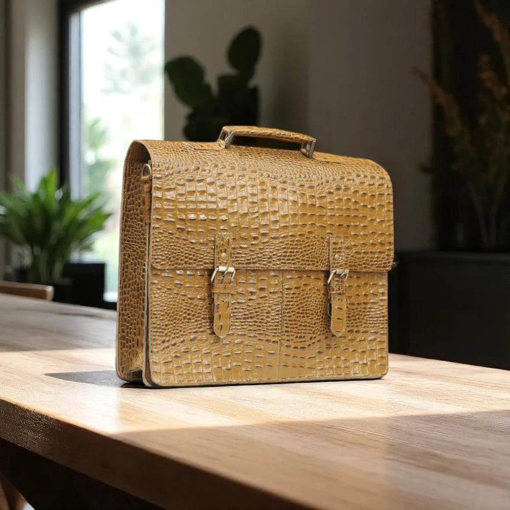 Expertly crafted with genuine alligator print leather, this handmade tan bag is perfect for the office or daily use. Its spacious design can accommodate a laptop, making it the ideal choice for tech-savvy professionals. A sophisticated and stylish choice for men, this bag is sure to elevate any outfit.