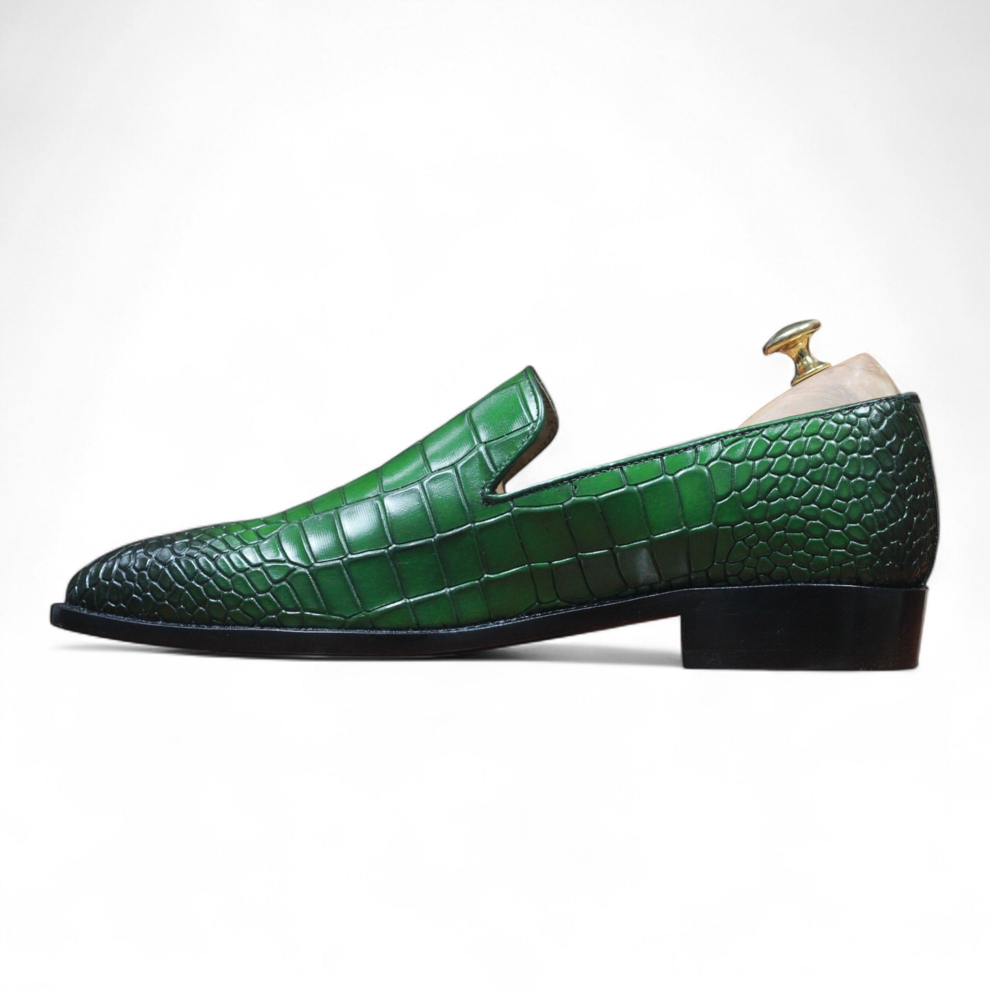 Stylish men's green leather loafers with exotic texture

