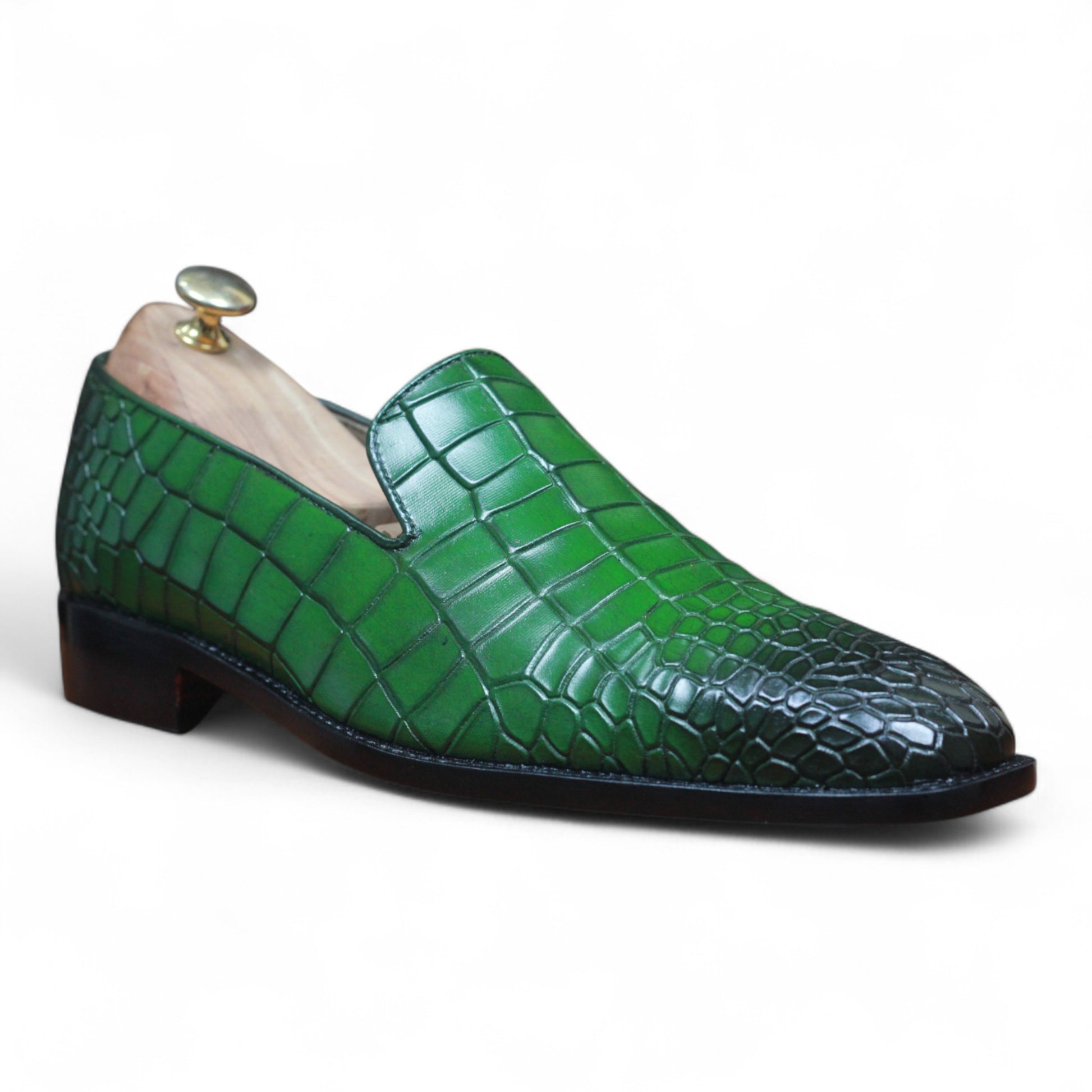 Handmade green loafers crafted with alligator-style leather


