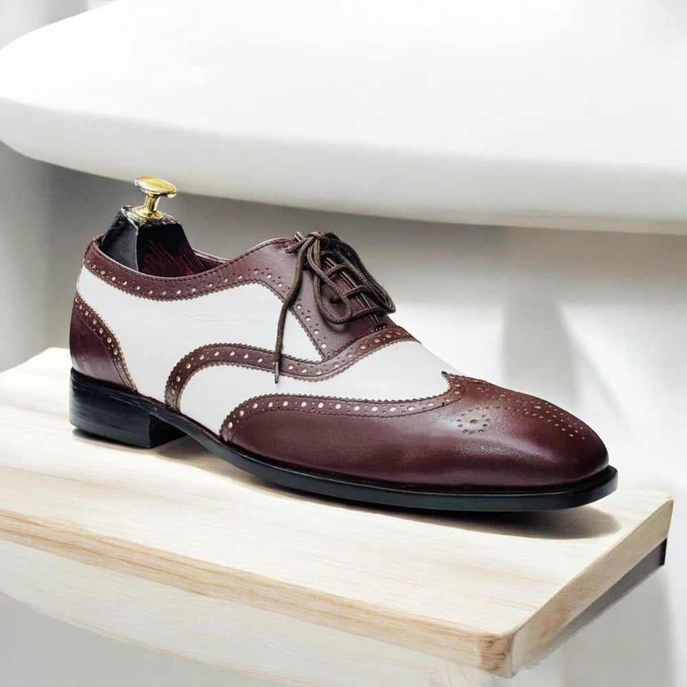 Handmade two-tone leather wingtip Oxfords in brown and white, with leather sole and available in USA sizes 5-15