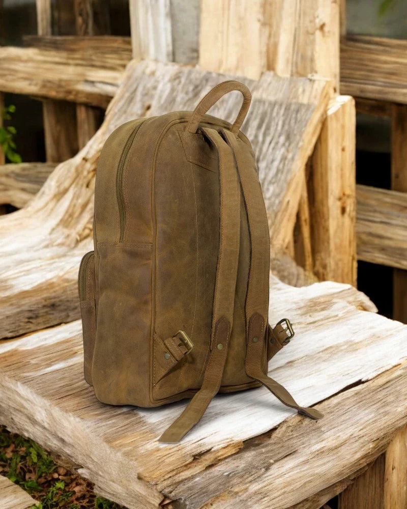Classic Leather Backpack for Men Women – Featuring a padded laptop sleeve, front zipper pocket, and sturdy leather straps.