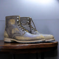 Men's vintage brown ankle boots made from genuine leather, showcasing a distressed finish and a classic design for a stylish, rugged look.