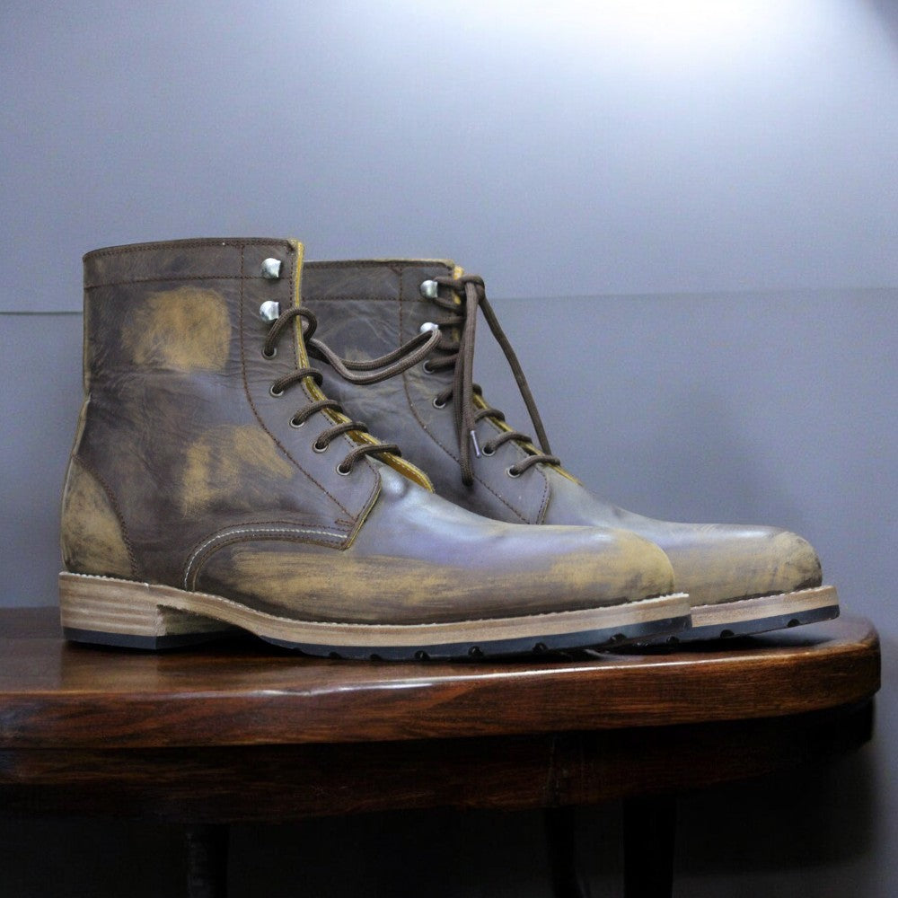 Men's vintage brown ankle boots made from genuine leather, showcasing a distressed finish and a classic design for a stylish, rugged look.