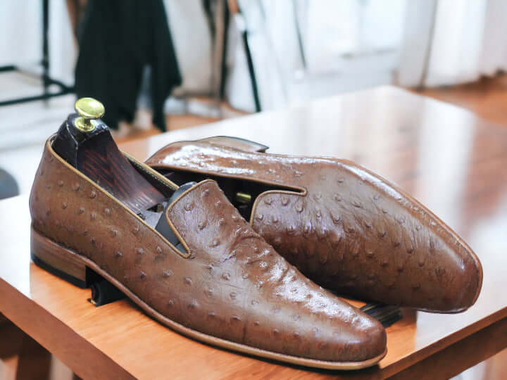 Elevate your look with these men's Ostrich print loafers. Crafted with genuine leather and designed with a timeless silhouette, these loafers are perfect for any formal or smart casual attire. The ostrich print gives these shoes extra texture and style, making you look fashionable and sophisticated.