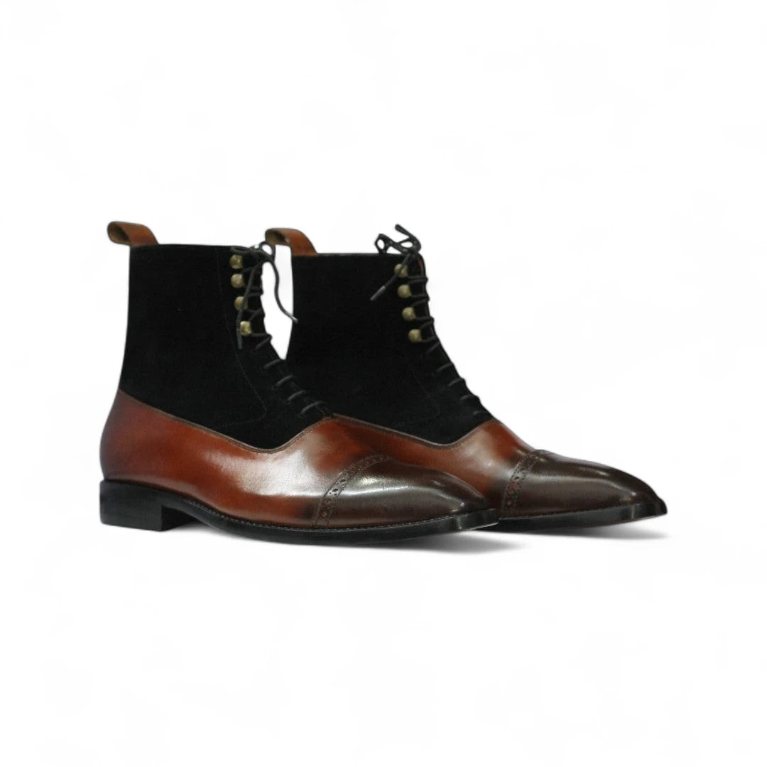 Brown and black dress boots on a white background