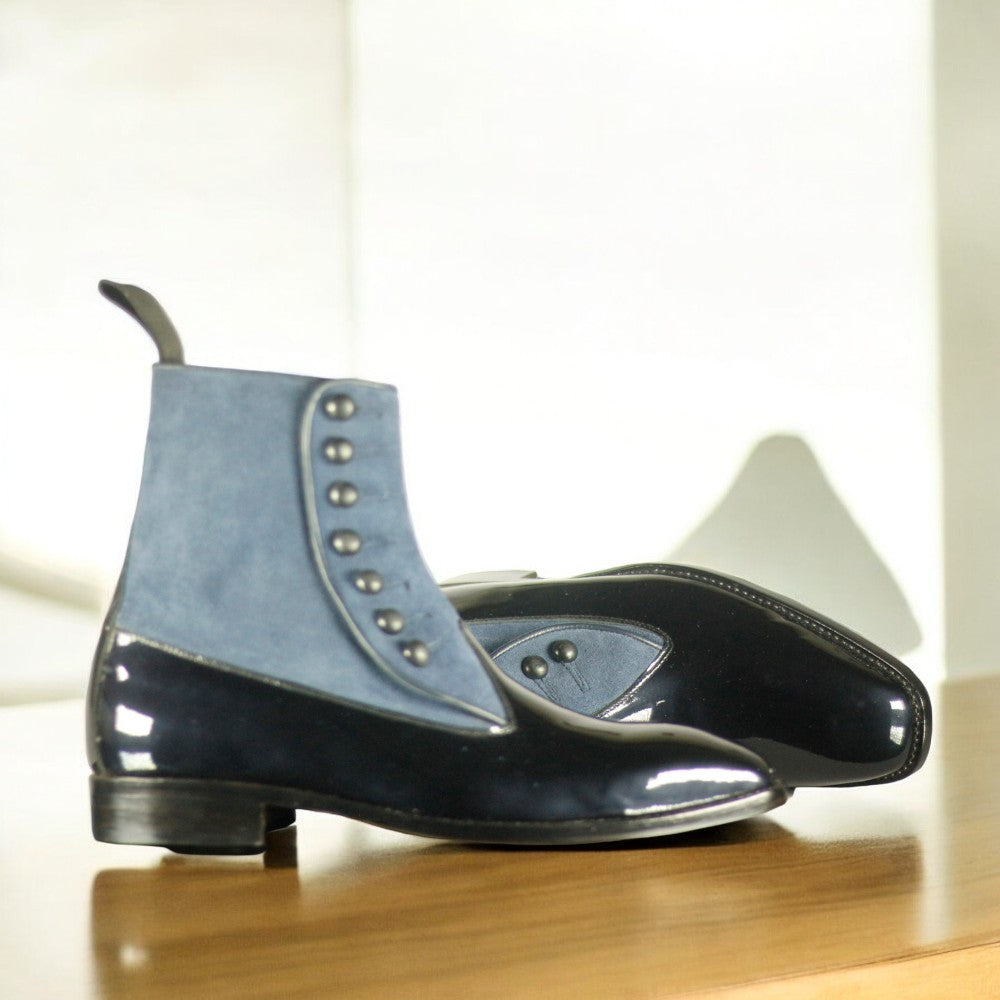 Men's Leather Suede Button Boots displayed on a wooden surface, showcasing their elegant design and craftsmanship.