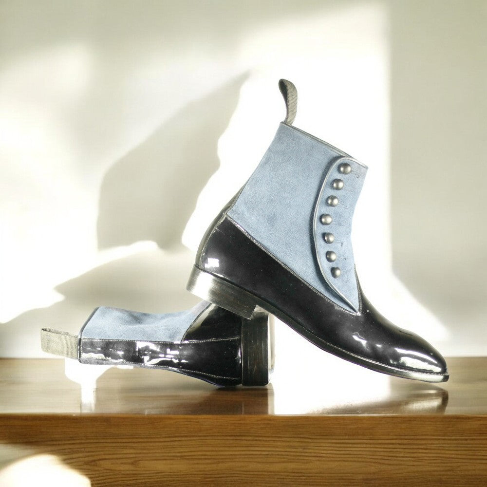 Men's Leather Suede Button Boots displayed on a wooden surface, showcasing their elegant design and craftsmanship.