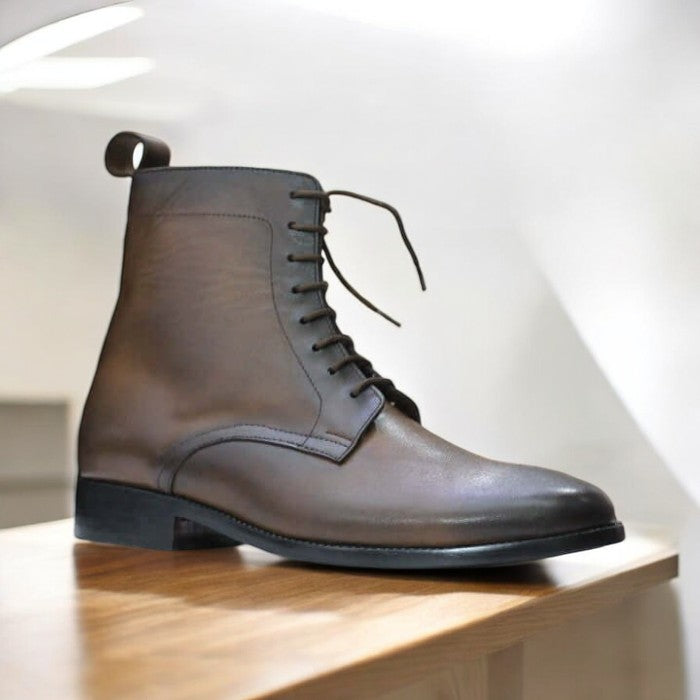 Handmade men's brown leather ankle boots with a cap toe and lace-up design, featuring premium leather and a durable sole, perfect for casual and semi-formal wear.
