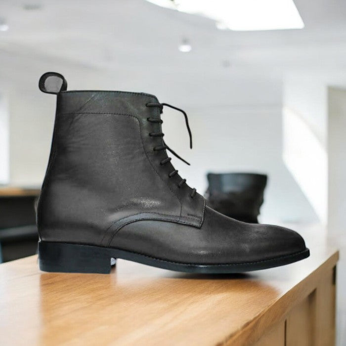 Handmade men's brown leather ankle boots with a cap toe and lace-up design, featuring premium leather and a durable sole, perfect for casual and semi-formal wear.