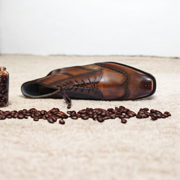 Handmade men's brown patina wingtip brogue dress boots with detailed perforations, lace-up closure, and a polished leather finish, perfect for formal or casual wear