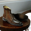 Men's brown genuine leather combat boots with a rugged military design, featuring reinforced stitching and a durable sole for optimal comfort and support