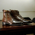 Men's brown genuine leather combat boots with a rugged military design, featuring reinforced stitching and a durable sole for optimal comfort and support
