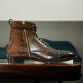 Men's brown genuine leather combat boots with a rugged military design, featuring reinforced stitching and a durable sole for optimal comfort and support