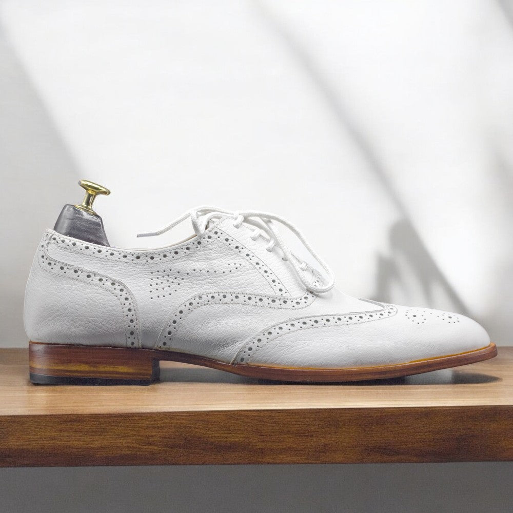 Men's Handmade White Leather Dress Wing Tip Style Shoes featuring classic wingtip design and premium craftsmanship.