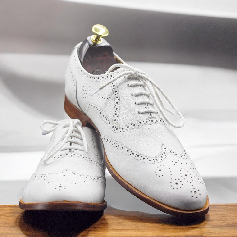Men's Handmade White Leather Dress Wing Tip Style Shoes featuring classic wingtip design and premium craftsmanship.