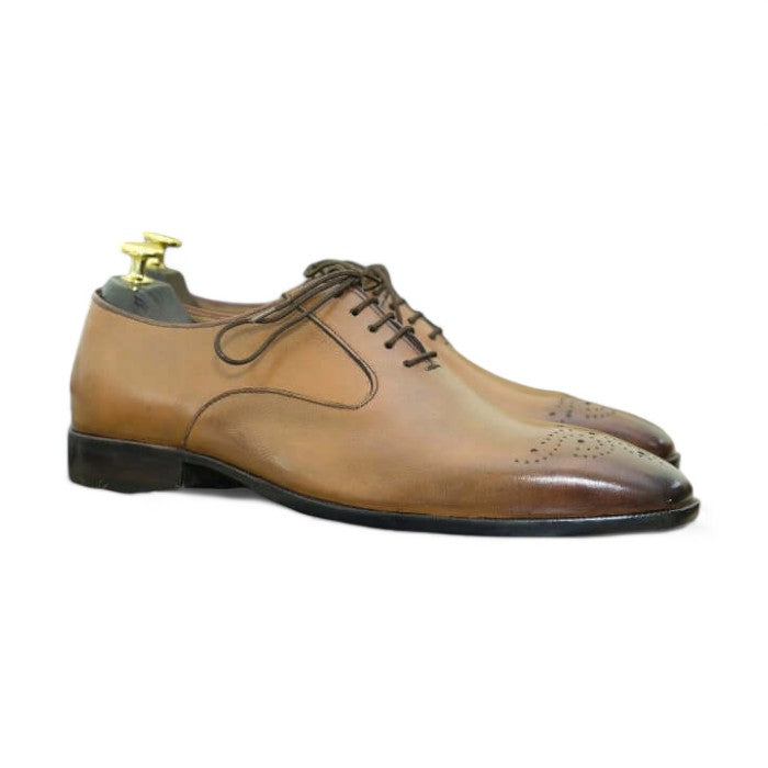 Men's tan whole cut leather lace-up shoes on a white background.
