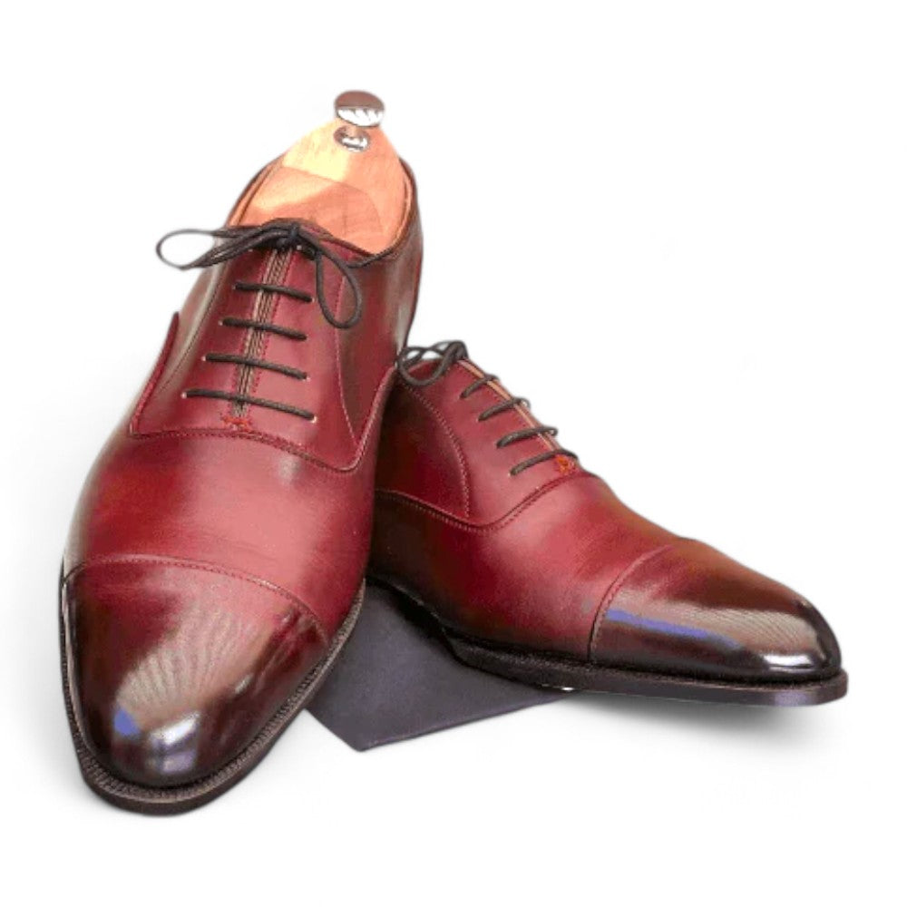 Men's Burgundy Leather Cap Toe Lace-Up Shoes, handcrafted from premium leather, featuring a classic cap toe design for formal and casual occasions.