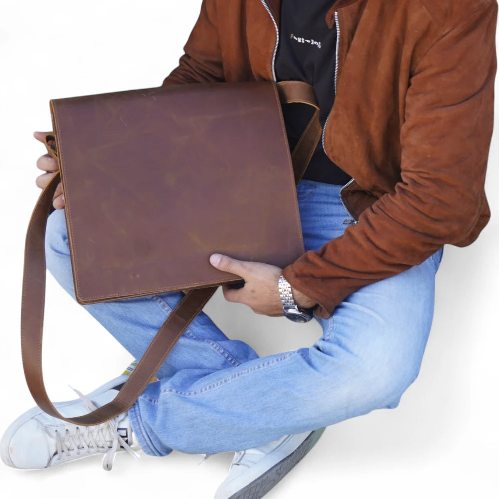 Top View – Overhead shot displaying the main flap, handle, and brass hardware.

