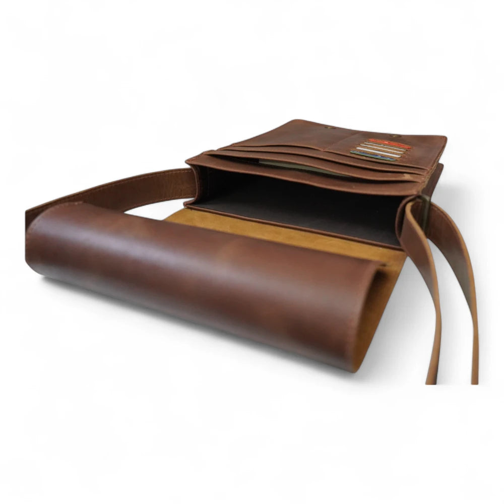 Inside View – Open bag showing padded laptop sleeve, pen loops, and internal cotton lining.

