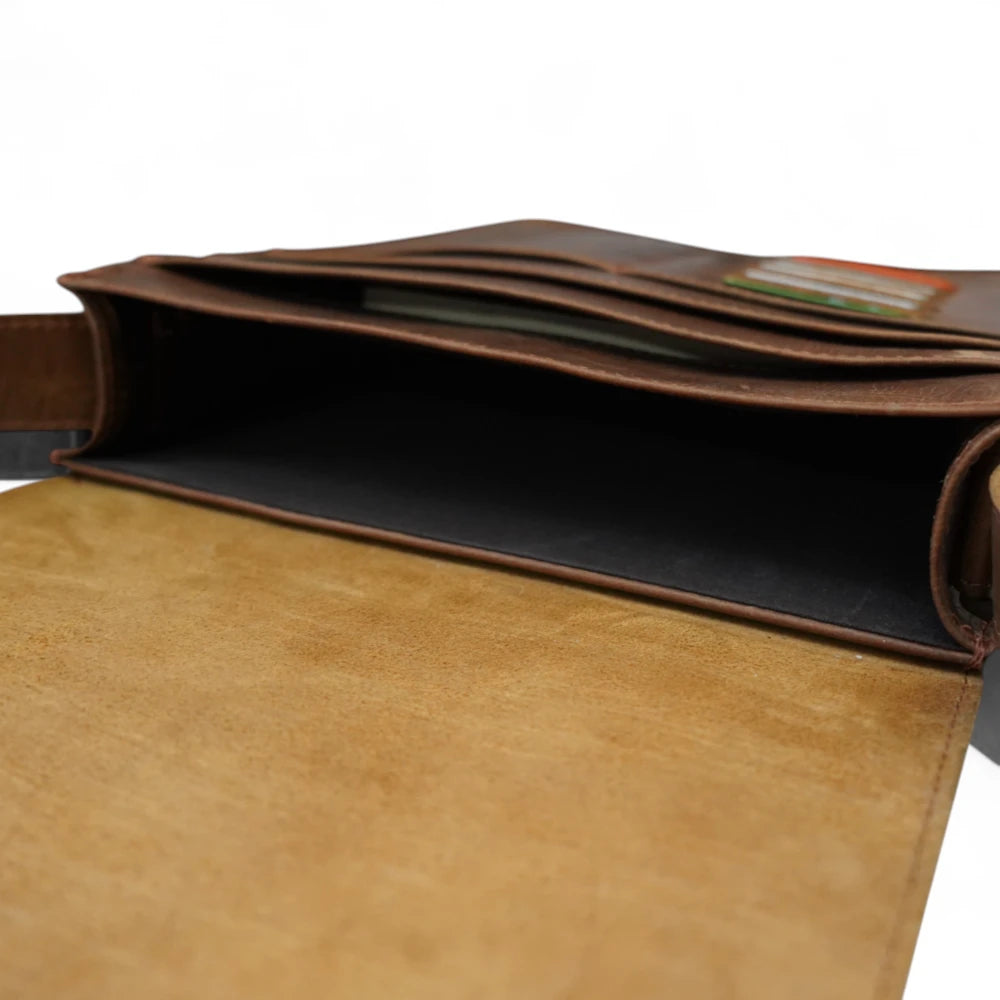 Inside View – Open bag showing padded laptop sleeve, pen loops, and internal cotton lining.


