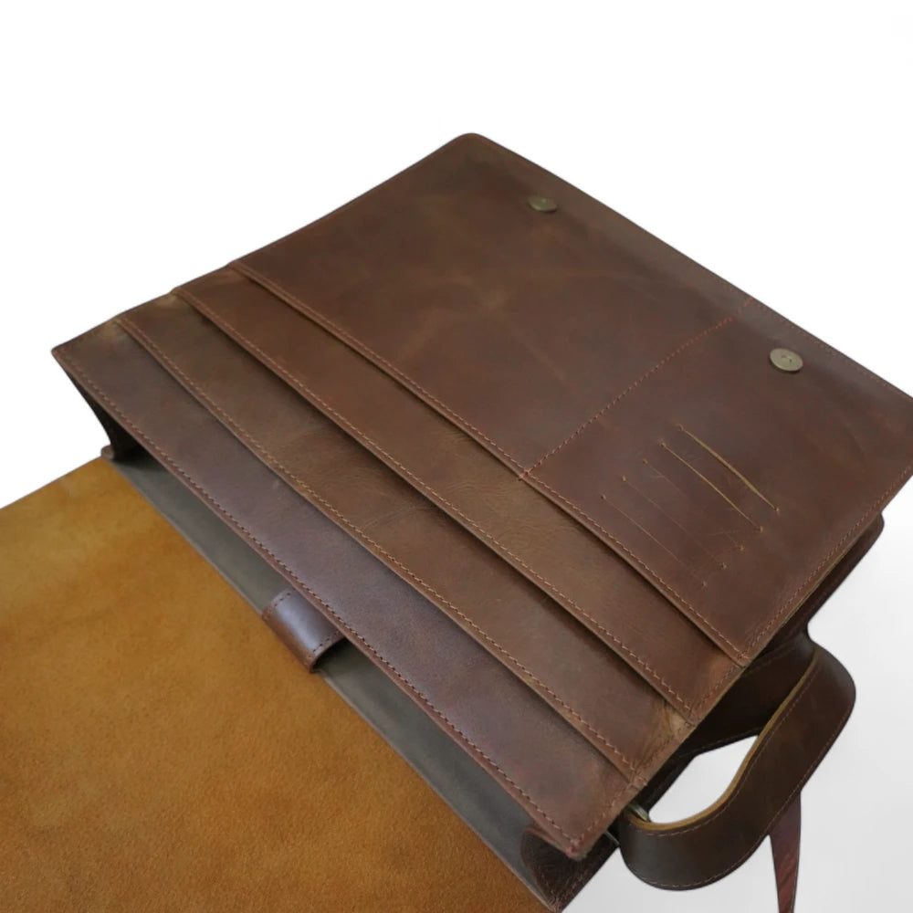 Inside View – Open bag showing padded laptop sleeve, pen loops, and internal cotton lining.