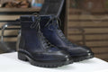 Stylish navy blue boots with durable design, perfect for versatile casual and formal wear.