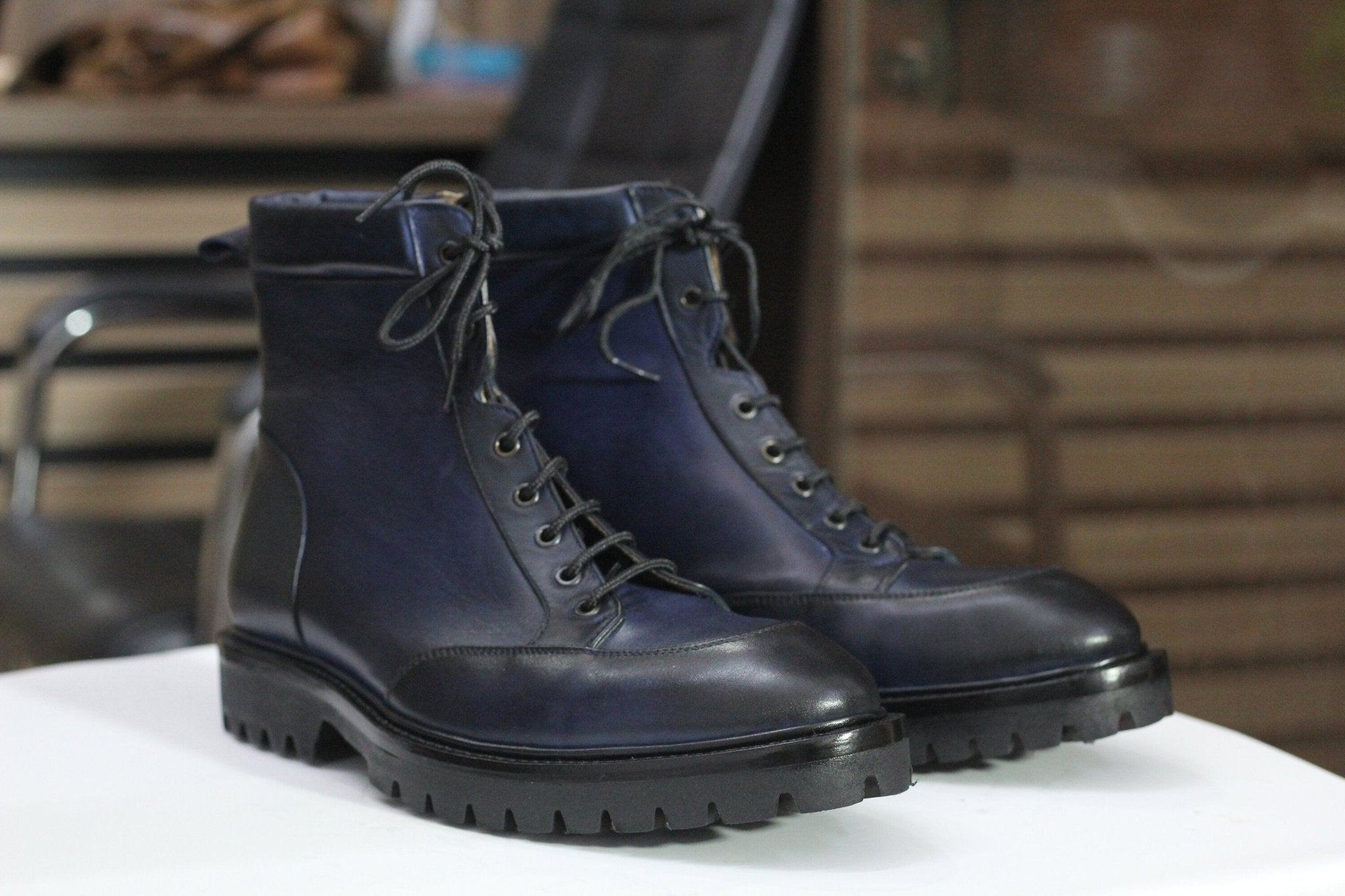 Stylish navy blue boots with durable design, perfect for versatile casual and formal wear.