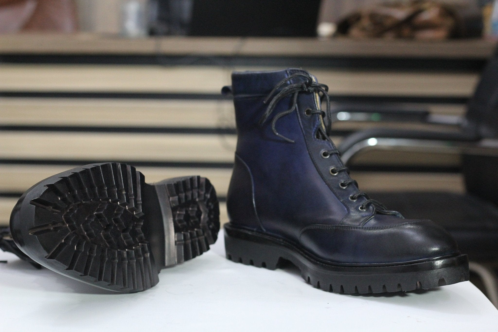 Stylish navy blue boots with durable design, perfect for versatile casual and formal wear.