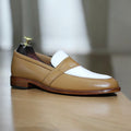 Men's brown and white penny loafers, handmade with premium leather, featuring a round toe and slip-on design, perfect for casual or semi-formal wear.