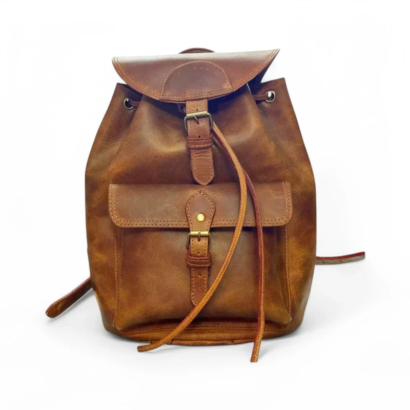 Expertly crafted from genuine leather, this handmade backpack is perfect for college students. The backpack features a front pocket for easy access to essentials, making it a practical and stylish choice for everyday use. Stay organized and look sophisticated with the Country Leather Backpack.