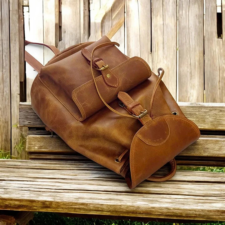 Expertly crafted from genuine leather, this handmade backpack is perfect for college students. The backpack features a front pocket for easy access to essentials, making it a practical and stylish choice for everyday use. Stay organized and look sophisticated with the Country Leather Backpack.