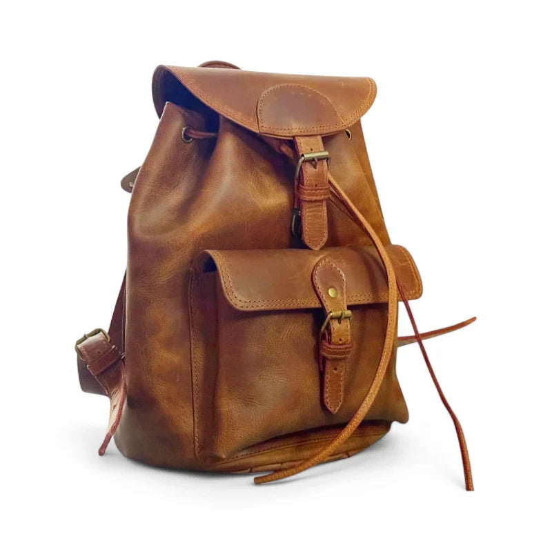 Expertly crafted from genuine leather, this handmade backpack is perfect for college students. The backpack features a front pocket for easy access to essentials, making it a practical and stylish choice for everyday use. Stay organized and look sophisticated with the Country Leather Backpack.