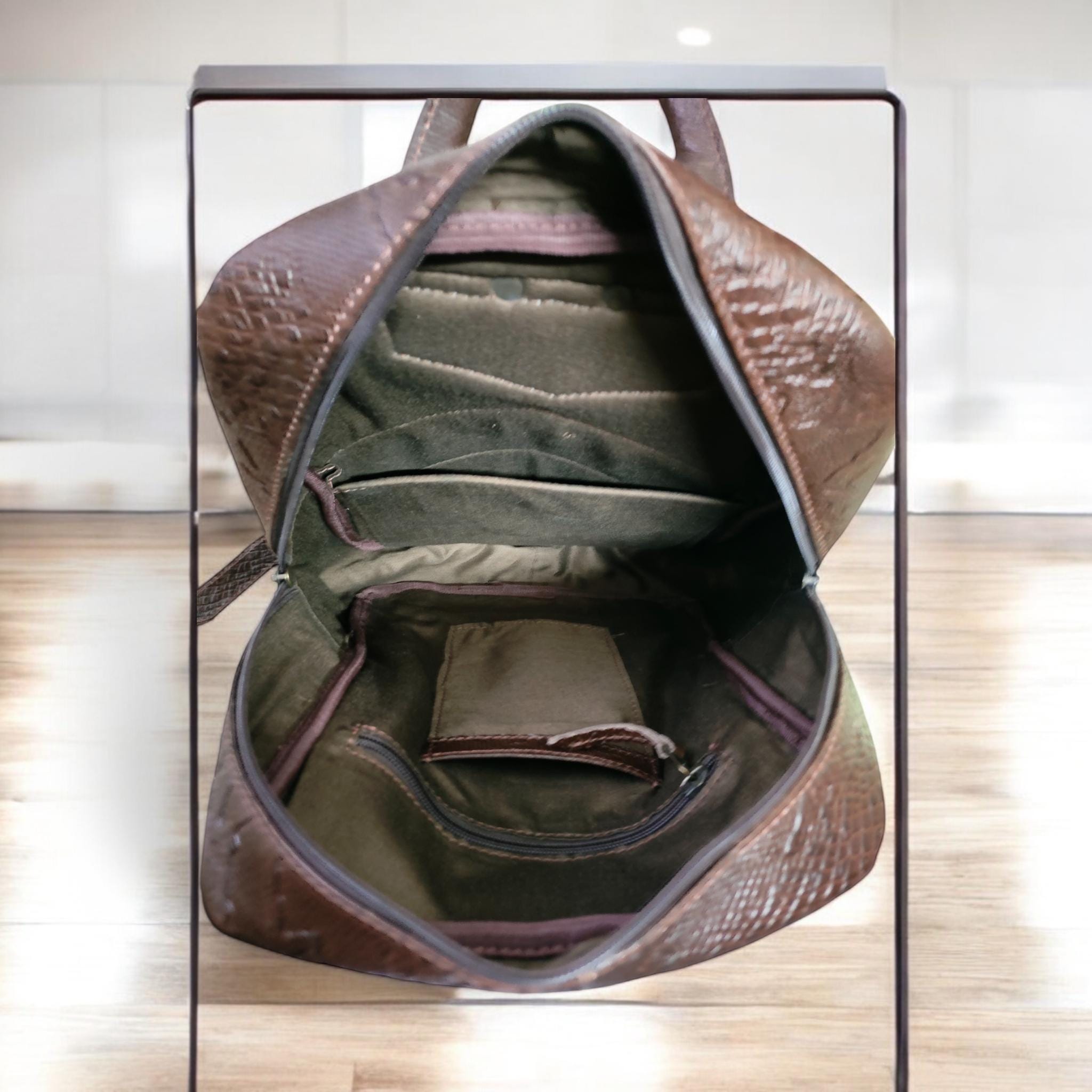 Open Interior View – Inside view of the backpack showing padded laptop sleeve and slip pockets.

