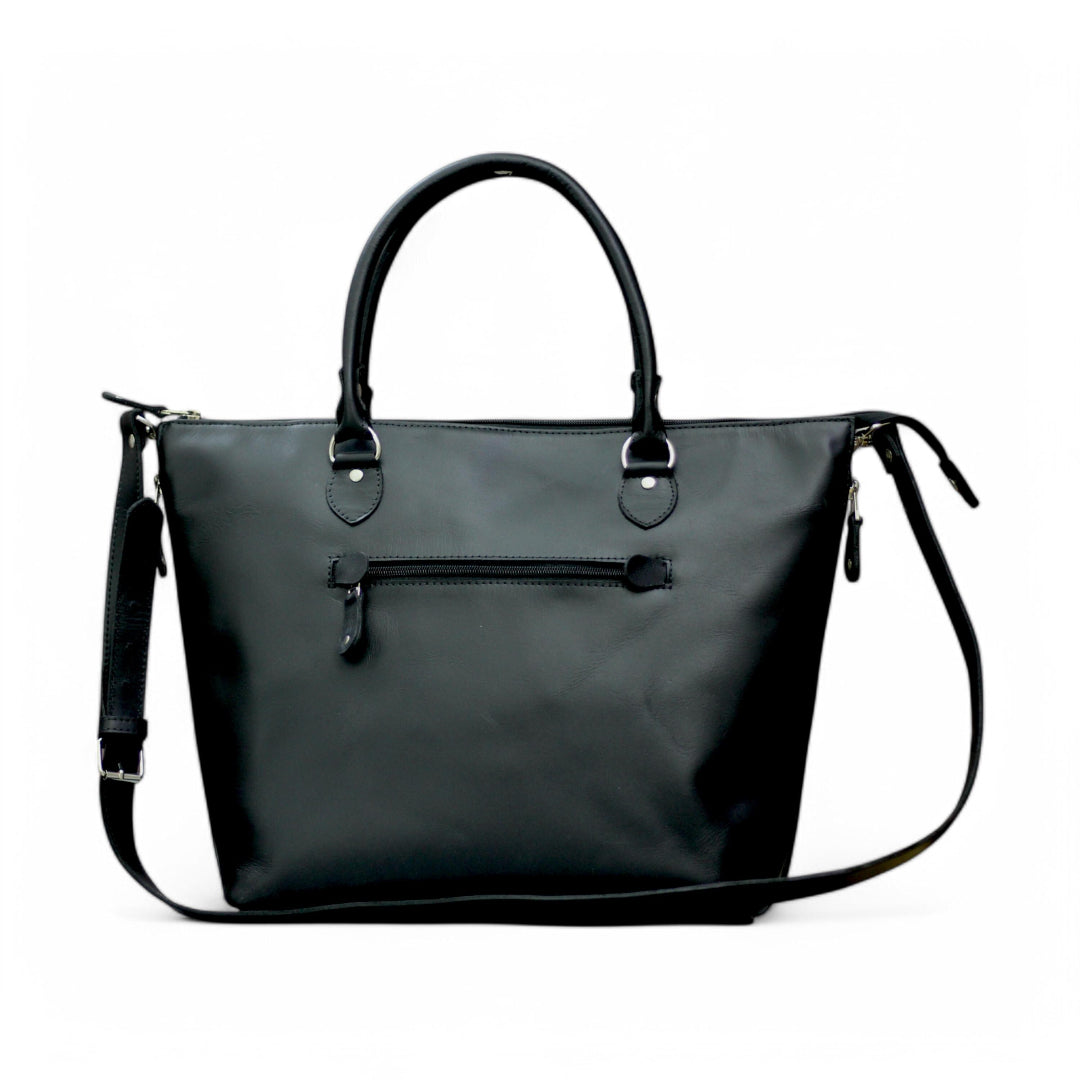 Front View – Classic leather tote bag in tan with clean lines and personalized initials on front.

