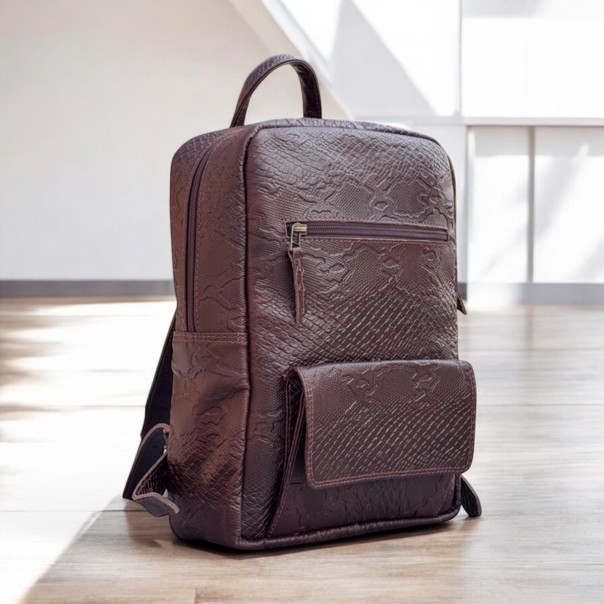 Side View – Compact side angle revealing depth and side snap pocket for small item access.

